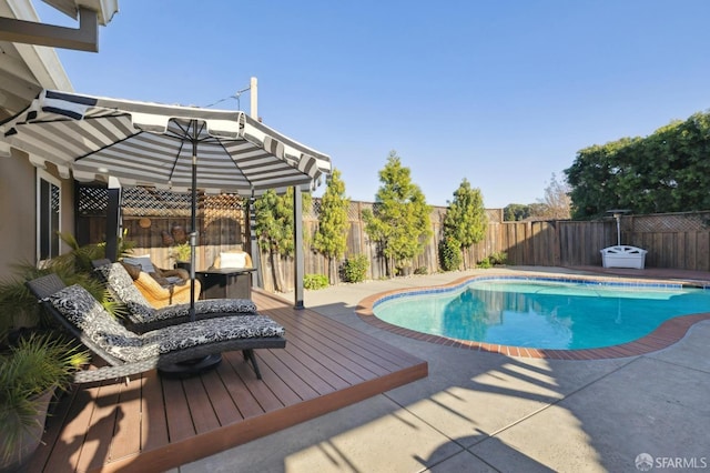 view of swimming pool with a patio area