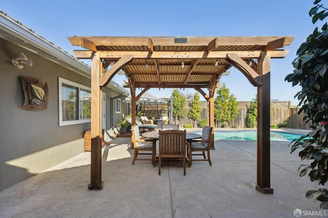 view of patio / terrace with a fenced in pool and a pergola