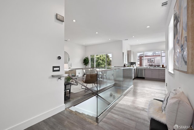 interior space with light hardwood / wood-style flooring and sink