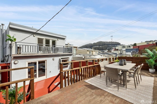 wooden deck with outdoor dining space