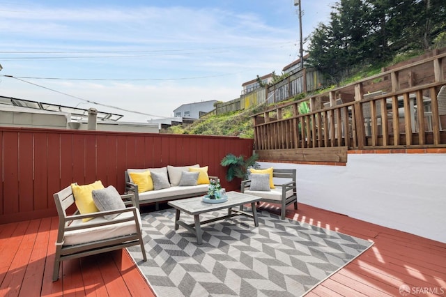 deck with fence and an outdoor living space