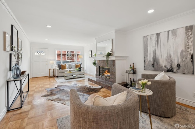 living area with recessed lighting, crown molding, baseboards, and a premium fireplace