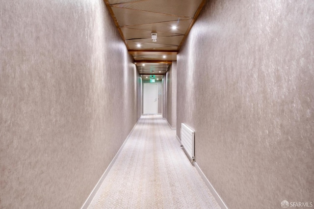 hallway with carpet flooring