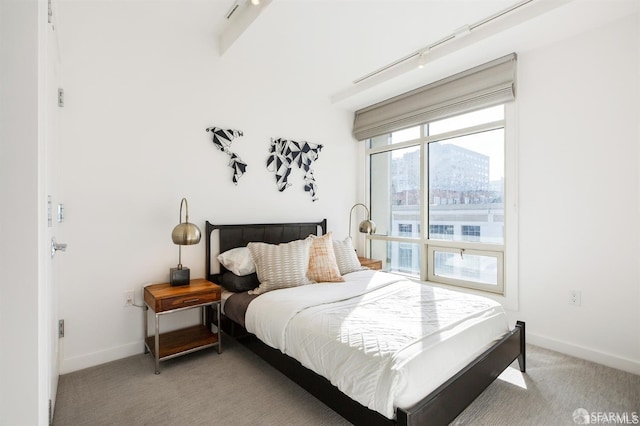 bedroom featuring light carpet