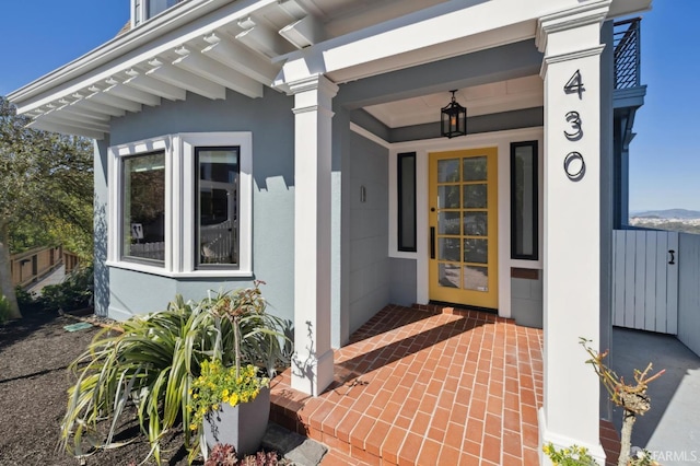 view of exterior entry with stucco siding