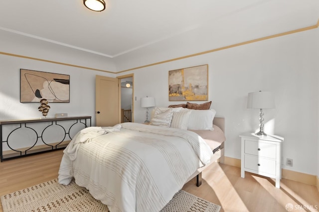bedroom with light wood-type flooring