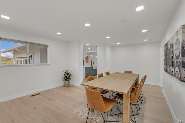 dining space featuring light hardwood / wood-style floors