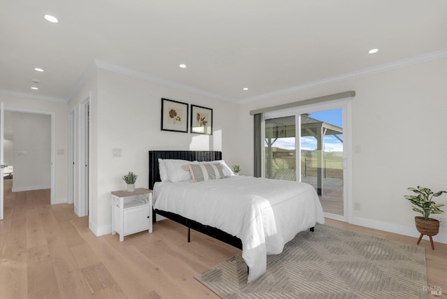 bedroom featuring access to exterior, crown molding, and light hardwood / wood-style floors