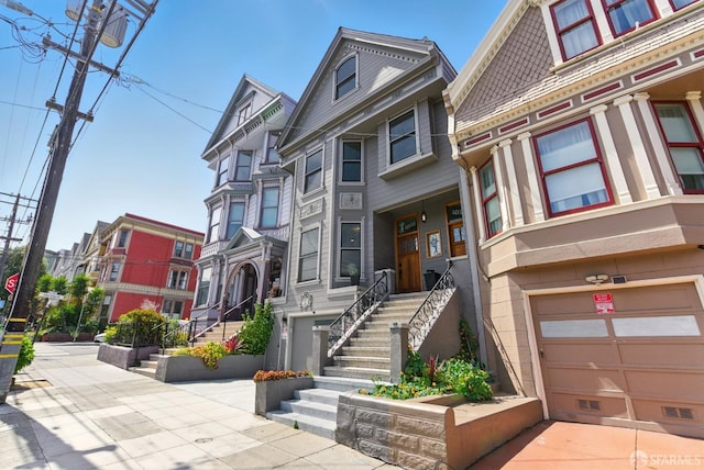 4038 18th St, San Francisco, CA 94114 - victorian house with an attached garage and stairway