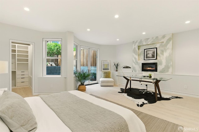 4038 18th St, San Francisco, CA 94114 - bedroom with recessed lighting, a fireplace, a spacious closet, wood finished floors, and access to outside