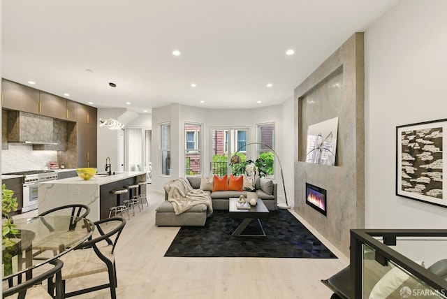4038 18th St, San Francisco, CA 94114 - living room featuring recessed lighting, light wood-style flooring, and a fireplace