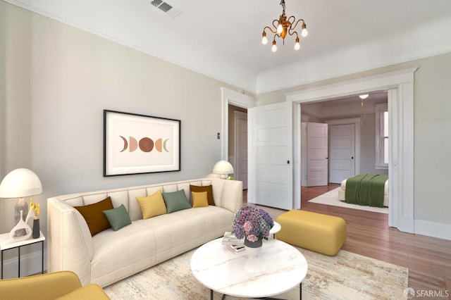 living room with a notable chandelier and wood-type flooring