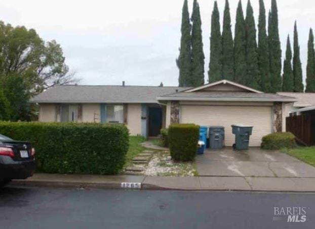 ranch-style house featuring a garage