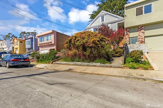 view of front of property with a residential view and brick siding