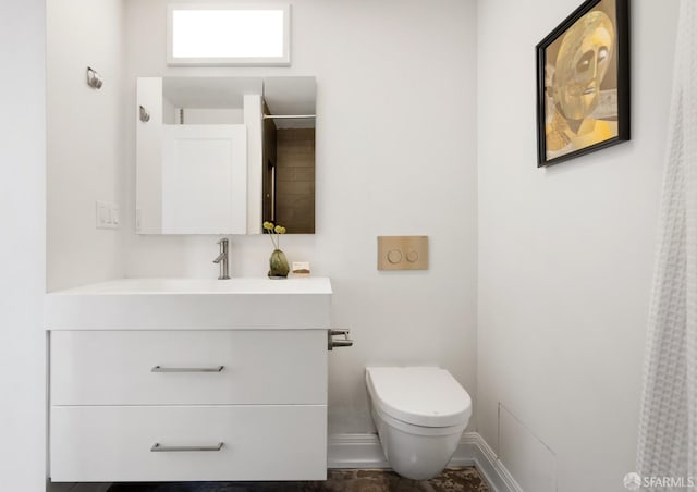 bathroom featuring walk in shower, vanity, and toilet