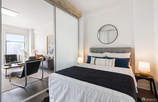 bedroom with wood-type flooring