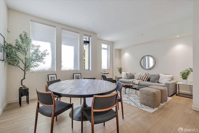 dining room with light wood-type flooring