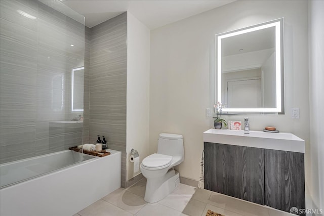 full bathroom featuring tile patterned floors, vanity, toilet, and tiled shower / bath