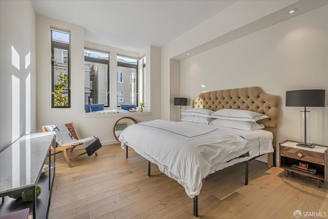 bedroom with light wood-type flooring