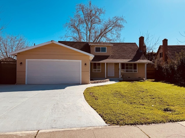 view of front facade featuring a front lawn, driveway, a chimney, and an attached garage