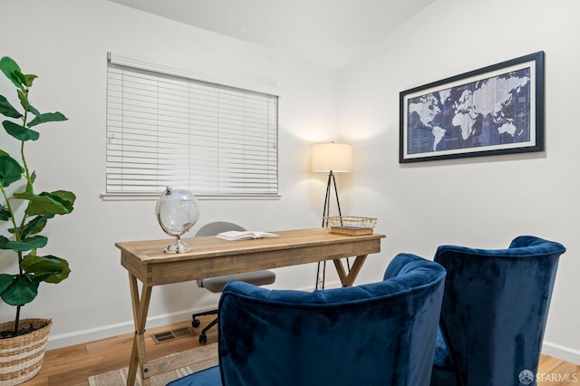 office featuring baseboards and wood finished floors