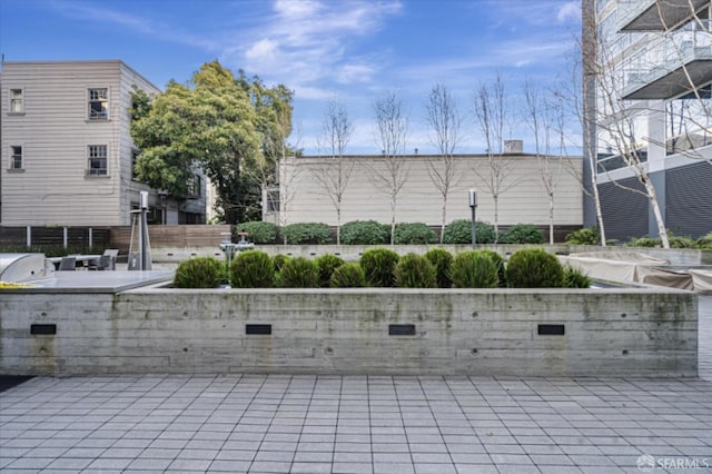 view of patio / terrace with fence and an outdoor kitchen