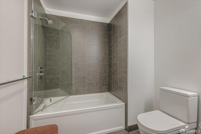 bathroom featuring bathtub / shower combination and toilet