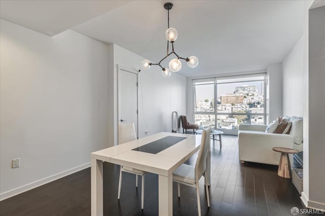 dining area with baseboards, floor to ceiling windows, dark wood finished floors, and a chandelier