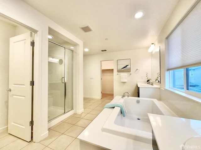 bathroom with vanity, shower with separate bathtub, and tile patterned flooring