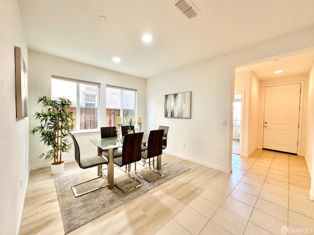 dining space featuring light wood-type flooring