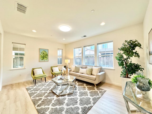 living room with light hardwood / wood-style floors