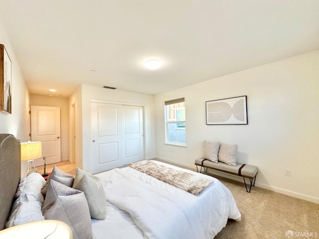 carpeted bedroom featuring a closet