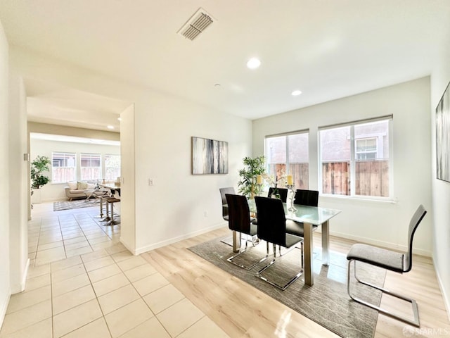 dining area with light wood-type flooring