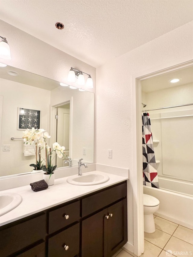 full bathroom with vanity, shower / bath combo, toilet, and tile patterned floors