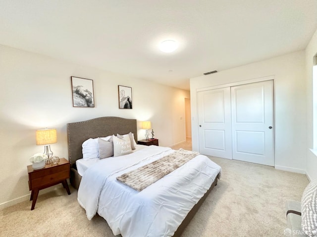 carpeted bedroom featuring a closet