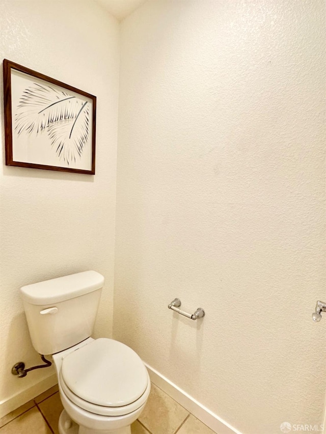 bathroom featuring toilet and tile patterned floors