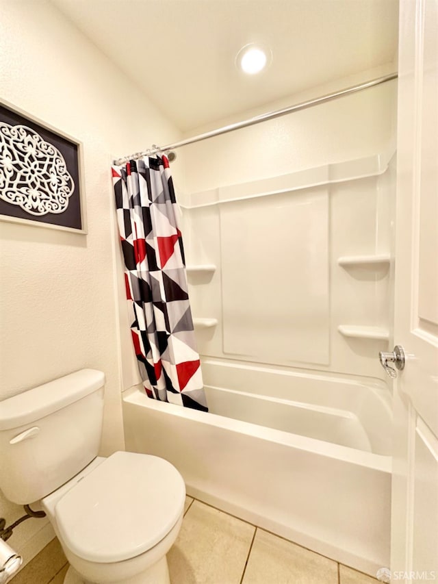 bathroom featuring toilet, shower / tub combo, and tile patterned flooring