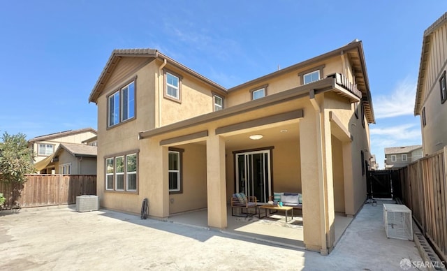 back of house with a patio area