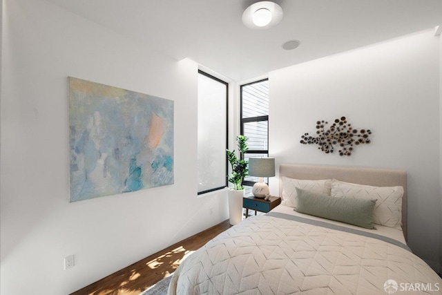 bedroom with wood-type flooring