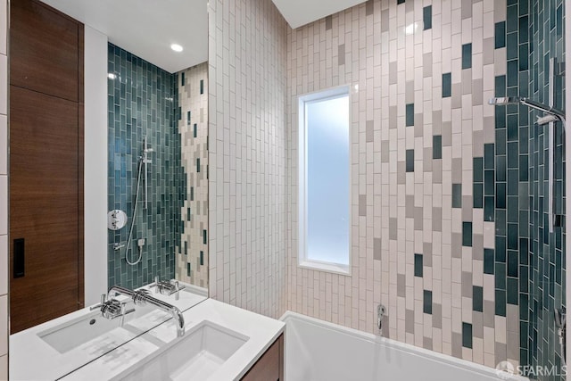 bathroom featuring a bath and vanity