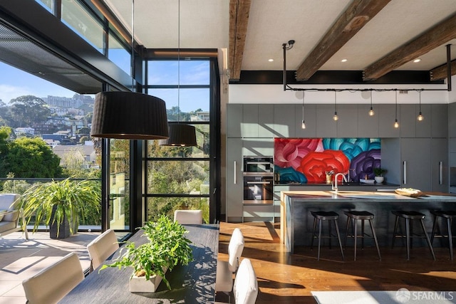 interior space featuring beam ceiling and hardwood / wood-style floors