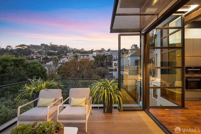 view of balcony at dusk