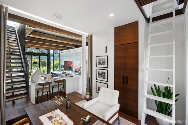 dining room with dark hardwood / wood-style flooring and expansive windows