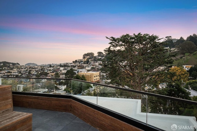 view of balcony at dusk