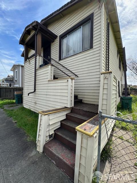 view of property exterior with fence