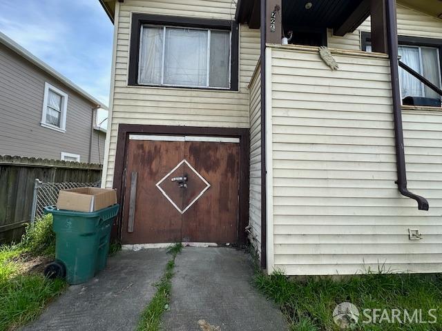 exterior space with a garage and fence