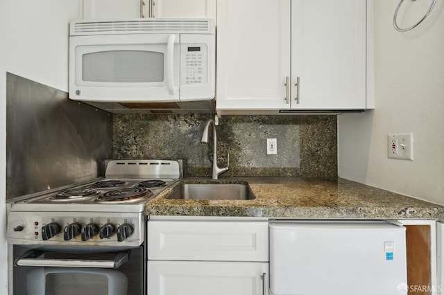 kitchen featuring decorative backsplash, white cabinetry, and stainless steel electric stove