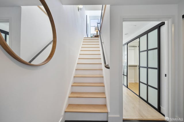 stairway with wood-type flooring