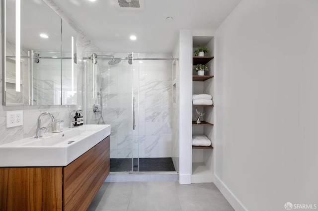 bathroom with vanity, an enclosed shower, and backsplash