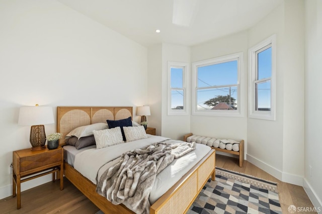 bedroom with wood-type flooring